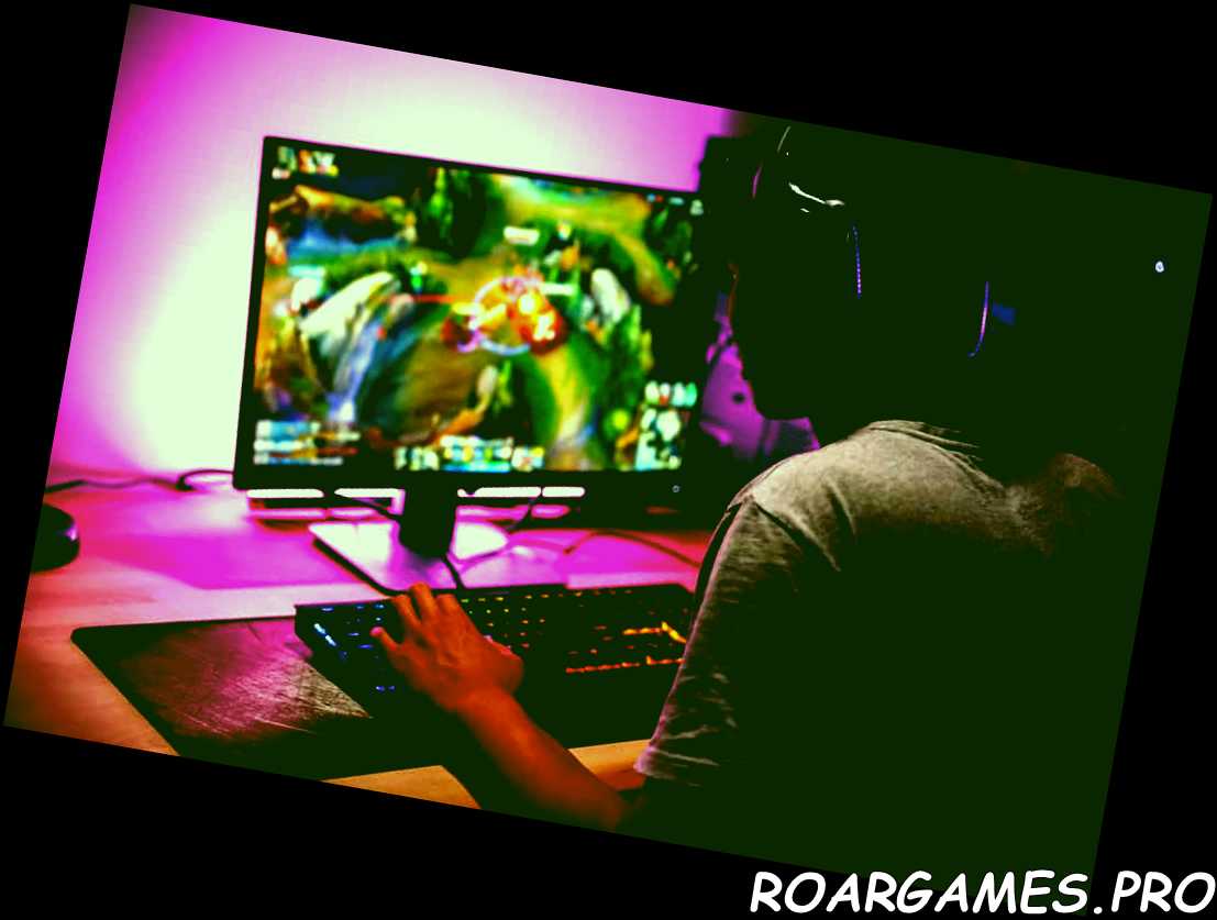 Foto de un jugador adolescente jugando videojuegos en la computadora